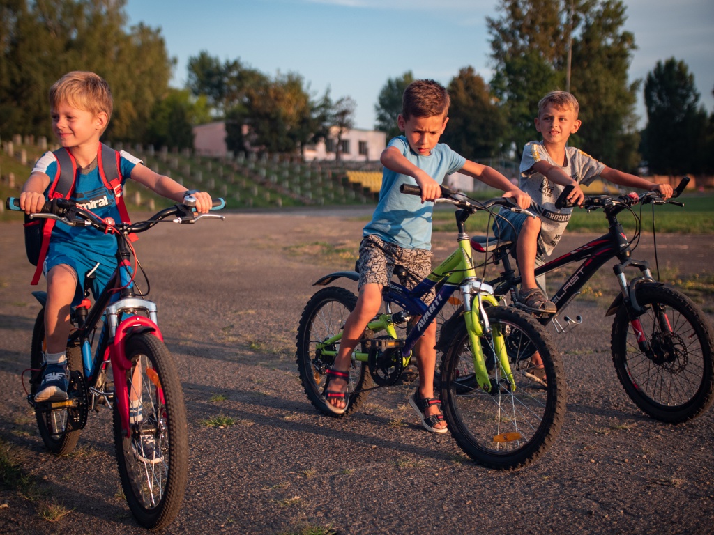 Canva - Three Boys Riding Their Bikes.jpg